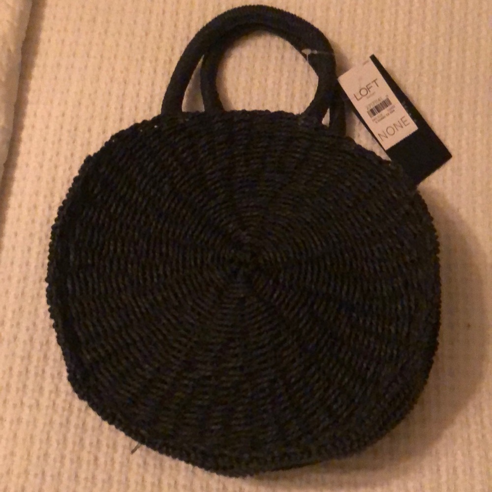 A black round straw bag